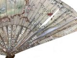 a fan that has a picture of a woman on it