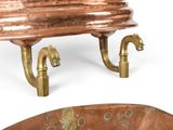 a large copper bowl with two handles and a small bowl with two handles