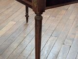 a wooden table with a drawer on it on a hard wood floor