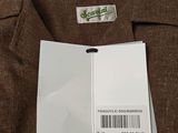 the back of a brown jacket with a barcode on it