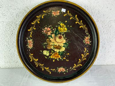 a decorative tray with flowers on it on a table