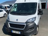 the white van is parked in a parking lot near other cars