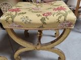 a small stool with a floral design on it