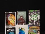 a lot of video games sitting on a black table