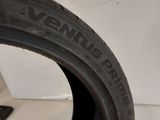 a close up of a tire on a white surface