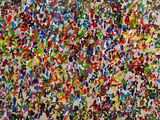an abstract painting of multicolored paint splattered on a wall