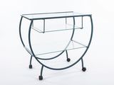 an image of a glass table with wheels and a glass shelf
