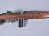 a close up of a rifle on a table with a gun in it