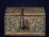 an old wooden box with a lock on it