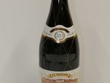 a bottle of wine that is sitting on a table