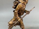 bronze figurine of a soldier with a rifle on a base