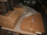 a pile of boxes on a pallet in a warehouse