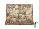 a close up of a tapestry hanging on a wall