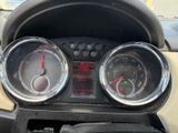 a close up of a dashboard with gauges on it