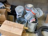 a pile of boxes and cans sitting on the floor