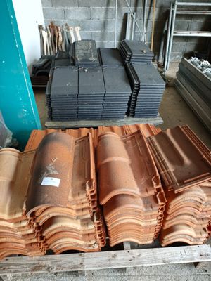 many different types of roof tiles stacked on top of each other