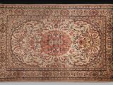 an antique persian rug with a medallion design