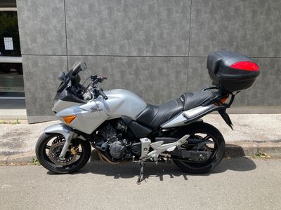 a motorcycle that is parked on the side of the street