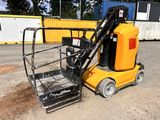 a small yellow machine that is sitting on the ground