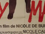 a poster for a movie with a man ' s legs on it