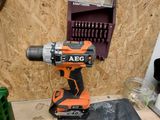 a drill that is sitting on top of a piece of plywood
