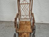 an old fashioned chair that is sitting on the ground