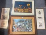 une photo montrant une collection d'œuvres d'art encadrées accrochées au mur