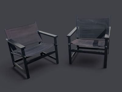 deux chaises noires et grises placées l'une à côté de l'autre sur une surface grise