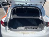 the trunk of a white car with its trunk open