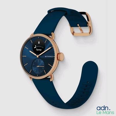 a close up of a wrist watch with a blue strap