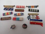several different types of ribbons and pins laid out on a table