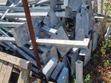 a pile of wood and metal on the side of the road