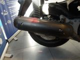 a close up of a motorcycle on display in a showroom