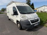 a white van that is parked on the side of the road