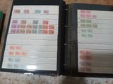 a binder with stamps on it sitting on a table