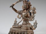 an image of a bronze statue of a woman holding a bird
