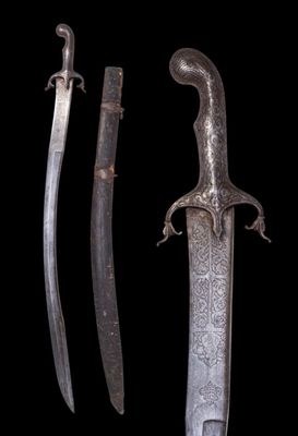 a close up of two swords on a black background