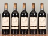 six bottles of wine are lined up on a table