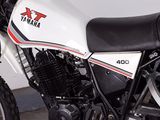 a white and black motorcycle parked in a garage