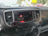 the dashboard of a car with a radio in the middle of it