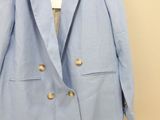 the jacket is blue and has gold buttons on it