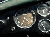 a close up of a dashboard with a clock and gauges