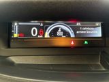the dashboard of a car with a digital display on it