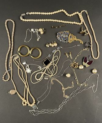 several different types of jewelry are arranged on a table