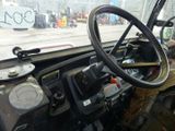 a steering wheel and dashboard of an old truck
