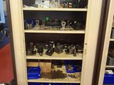 a cabinet with many tools on it in a room