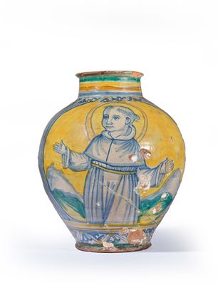 a yellow vase with a picture of a monk on it