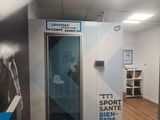 a bathroom with a toilet and a shower in it