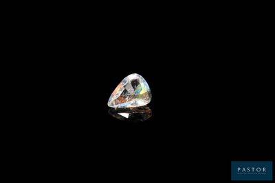 a white diamond on a black background with a reflection