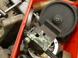 a red box filled with assorted tools on a table